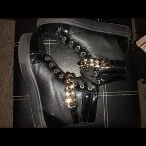 Black and gold sneakers